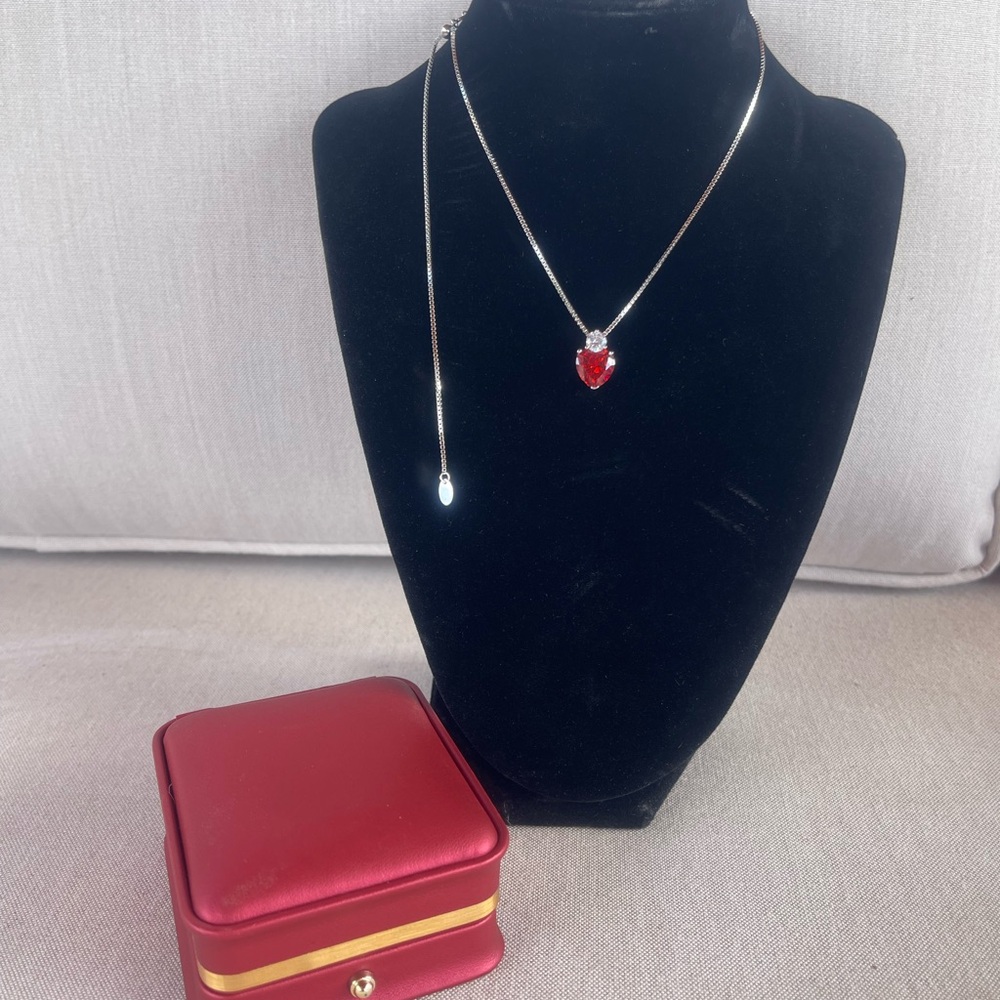 9.25 Sterling Silver Necklace with Heart Pendant with adjustable chain.